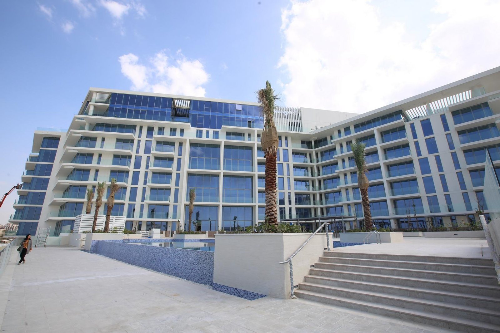 Luxury waterfront residences at Mamsha Al Saadiyat Saadiyat Island Abu Dhabi with private beach access, palm-lined walkways, and premium lifestyle amenities