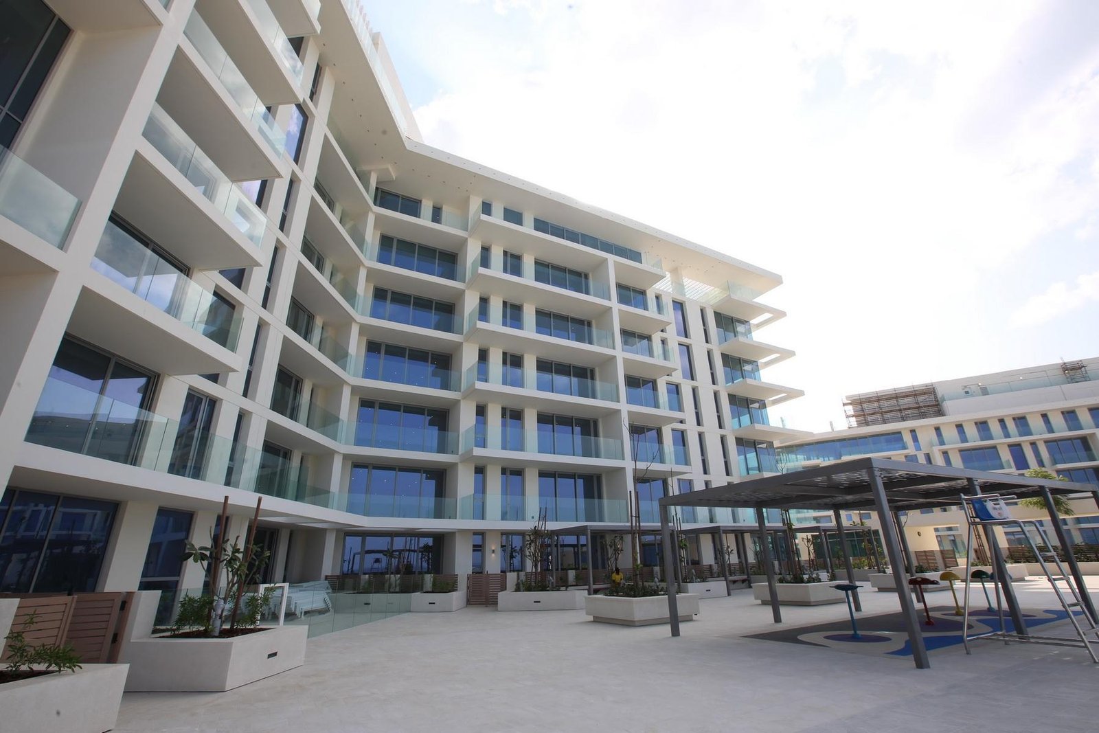 Mamsha Al Saadiyat beachfront exterior on Saadiyat Island Abu Dhabi featuring luxury apartments, modern architecture, and panoramic sea views